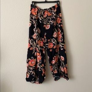 Floral print black and orange pants with leg slits